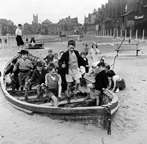00565 Prints: Children of Liverpool, Merseyside, playing in a bomb site left since the end of
