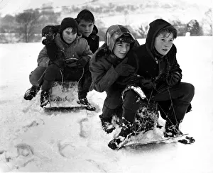 00174 Prints: Children from Llantrisant go tobogganing - sledging on the slopes