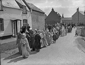Fair Prints: Children parade throughout the streets of Reach, dressed in medieval costumes for