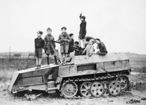 Nazi Prints: Children playing on armoured Nazi vehicle during the Second World War
