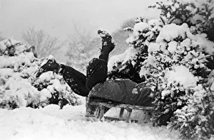 Children playing in the snow after a heavy fall at Hampstead Heath January