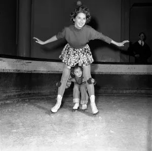 Ice Skating Prints: Children: Playing. In spite of the cold weather outside the Queensway Ice Rink, Bayswater