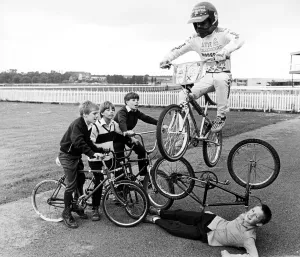00537 Prints: Children practising stunts at Stocktons redundant racecourse