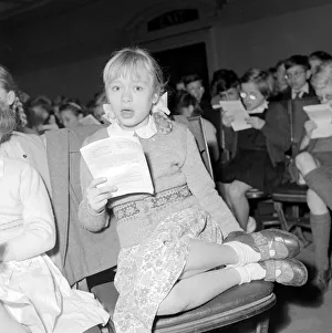 Children rehearse for the Carol Festival at the Central Hall Westminster December