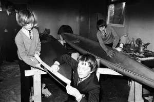 01509 Prints: Children at Sarah Metcalfe School build a canoe in Wood shop class, Middlesbrough