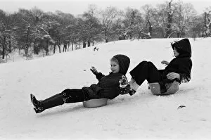 01476 Collection: Children sledging on washing up bowls in Greenwich Park, London, 27th December 1970