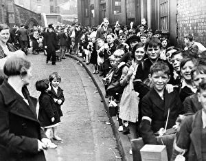 Students Prints: Children of St Vincent RC School line up with evacuation kit during a rehearsal