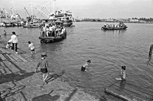 Images Dated 2nd February 1973: Children swimming in the Saigon River on the eve of Tet, the Vietnamese new year
