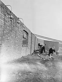 Vandalism Prints: Children throwing bricks at new-type street lamp shades, which will not break