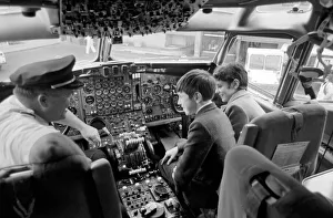 00031 Prints: Children Transport Aviation. Children looking at the controls of a TWA 707 plane in