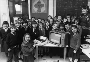 Children using computers. Teacher Heather Sedgwick and her band of happy pupils