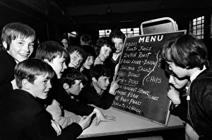 Children waiting for School Meals, check whats on the menu for today