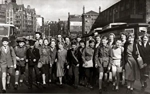 Children walk out of school together after breaking up for their Easter holidays March