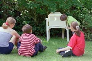 01106 Prints: Children watching the solar eclipse indirectly at Hightown. 11th August 1999