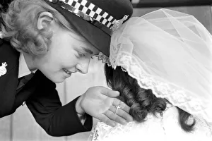 Children wedding has Police guard: Police guard for child bride wearing Pilkington