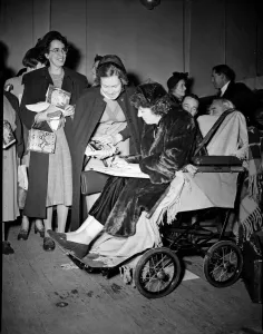 Queue Prints: Childrens Author Enid Blyton opens a Church Army Bazaar in England