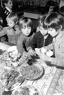 00176 Prints: Childrens birthday party Nicky eating on his 6th birthday March 1975