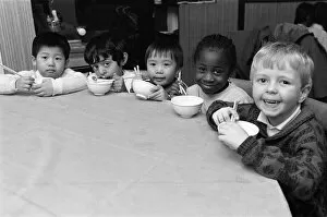 Images Dated 6th February 1989: Chinese children Hom Wah Ho (left) and William Cheung (centre) just couldn