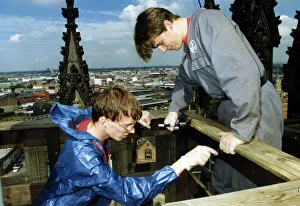 Chris Armstrong (left) and Carney Edwards strip and creosote the safety rails around