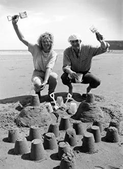 Chris Bird and Carole Smithson get in some practice at the sandpit building for