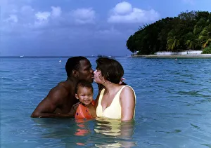 Chris Eubank Boxer in the sea in barbados with his wife Karron and son Chistopher