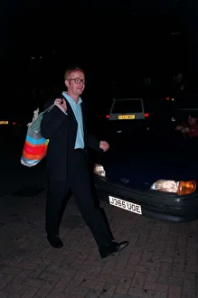 00145 Prints: Chris Evans Radio / TV Presenter June 1998 On a night out holding bag