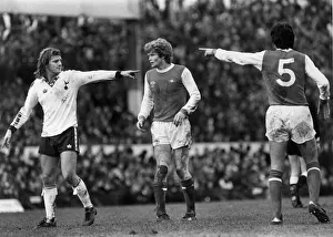 Chris Jones of Spurs (left) and David O Leary (right) pivot round Willie Young