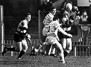 Pass Prints: Chris Webber of Cardiff passes over the head of Cambridges Andy Sutton