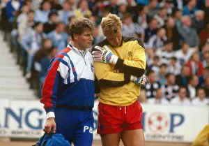 00247 Prints: Chris Woods led off field by Phil Boersma August 1989