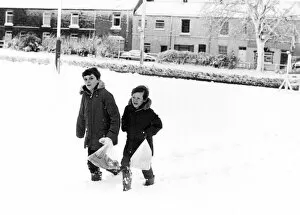 Images Dated 24th January 1984: Christian Clapton (left) and Paul Isbel (right) trudge through the thick snow to get to