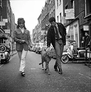 Christina Spooner and singer Tom Jones with Cheetah Kinna walk down Carnaby Street to