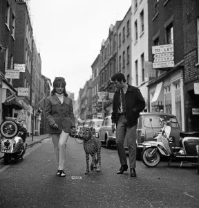 Christina Spooner and singer Tom Jones with Cheetah Kinna walk down Carnaby Street to
