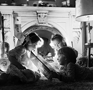 Nighttime Prints: Christmas Eve, Children reading bedtime stories as they wait for Santa, Newcastle