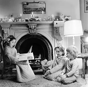 Christmas Eve, Children reading bedtime stories as they wait for Santa, Newcastle