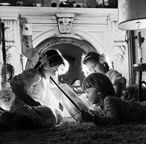 Christmas Eve, Children reading bedtime stories as they wait for Santa, Newcastle