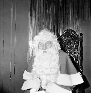 00030 Prints: Christmas Humour - Santa. Father Christmas at Lewiss store in Manchester