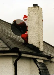 Christmas - Satellite and tv aerial installer Matthew Bloom dressed as Father Christmas