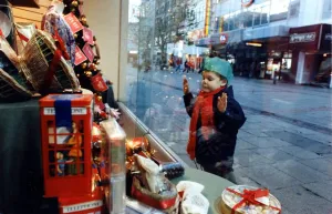 00193 Prints: Christmas - A young child peers at the Christmas decorations