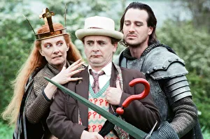 Christopher Bowen as Mordred crosses swords with Sylvester McCoy as the Doctor along