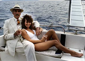 Champagne Prints: Christopher Lee and Linda Lusardi in the film Olympus Force May 1988