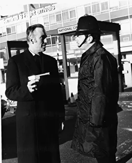 Christopher Lee pointing his Golden Gun'at a policeman after his arrival