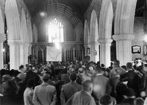 00075 Prints: Church meeting before villagers evacuate to allow American army manouvres