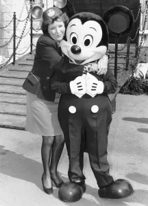 Cilla Black with Disney characters in Battersea park at the giant model which Disney