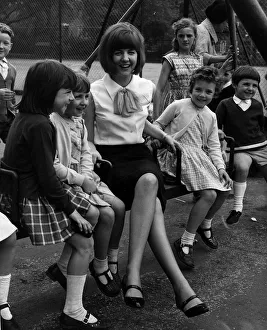 Cilla Black pop singer entertainer in childrens playground Coram Fields London