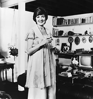 Cilla Black Singer / TV Presenter At home holding glass wine MSI