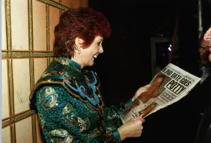 Cilla Black TV Personality reading Daily Mirror during Panto rehearsals at the Wimbledon