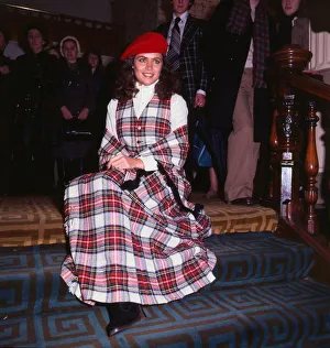 00350 Prints: Cindy Breakspeare Miss World 1977 wearing tartan outfit dress sitting on stairs