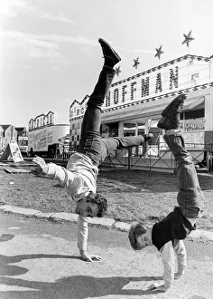Circus Prints: Circus performers, Otto Europa and his nine year old son standing on their hands