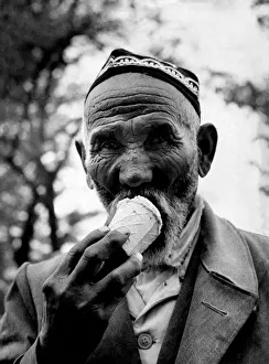 Licking Prints: A citizen of one of the U. S. S. R. central states seen here enjoying an ice cream