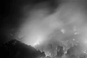 The City of London ablaze seen from the roof of the Northern facade of St Paul